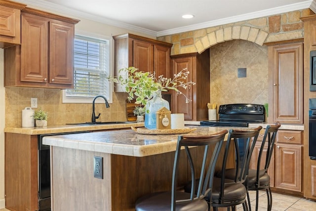 kitchen with a kitchen island, ornamental molding, backsplash, black electric range oven, and a sink