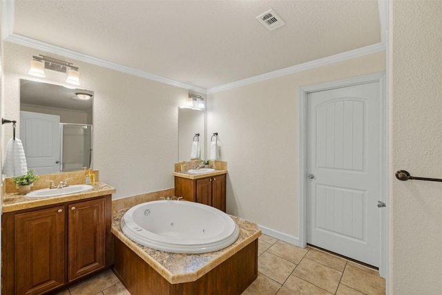 bathroom with tile patterned flooring, a shower stall, visible vents, and a sink