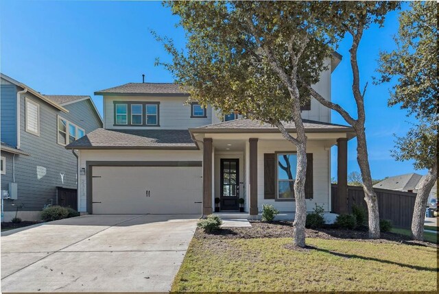 view of front of property featuring a garage and a front yard