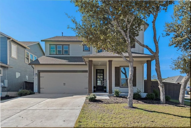 view of front facade with a garage, fence, a front lawn, and concrete driveway