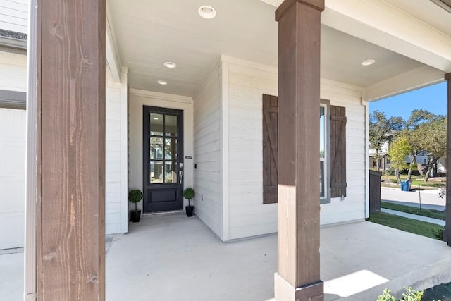 view of exterior entry featuring a garage