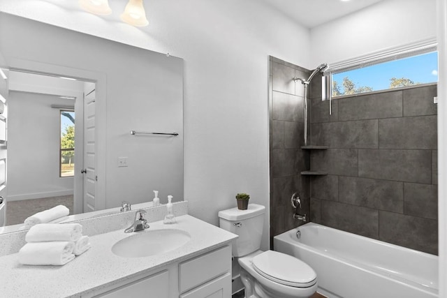 full bath featuring toilet, vanity, and washtub / shower combination