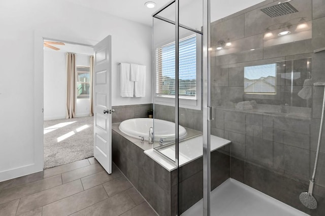 full bathroom with a garden tub, a shower stall, and tile patterned flooring