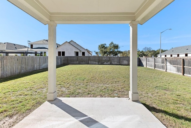 view of yard with a patio and a fenced backyard