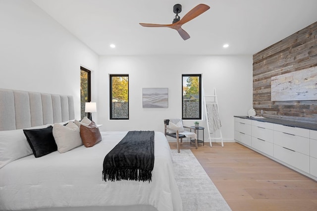 bedroom with light wood-type flooring and ceiling fan