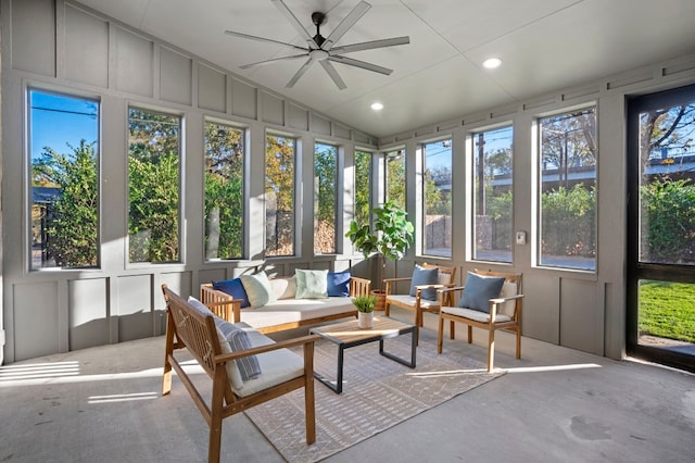 sunroom featuring a wealth of natural light, lofted ceiling, and ceiling fan