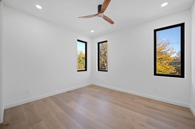 spare room with ceiling fan and light hardwood / wood-style floors