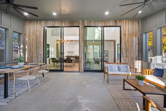 interior space featuring ceiling fan and a wealth of natural light