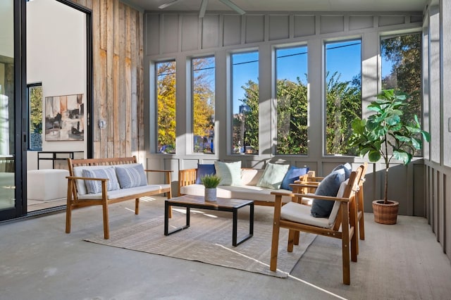 sunroom featuring lofted ceiling