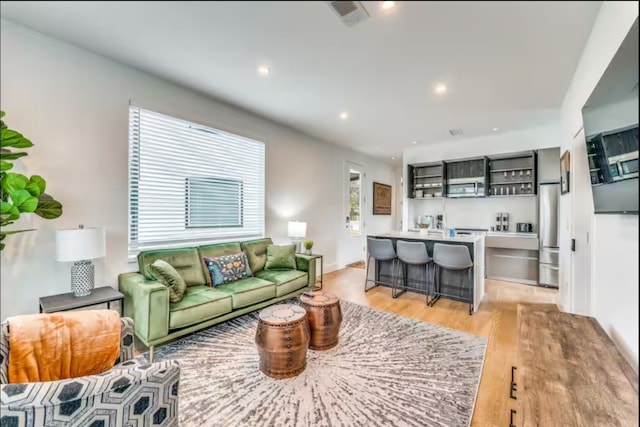 living room with light hardwood / wood-style floors