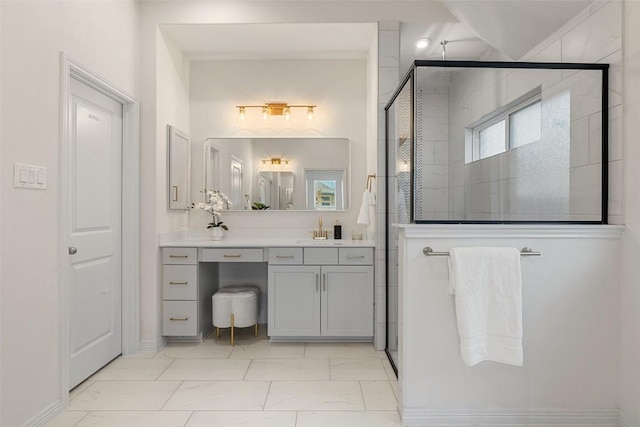 bathroom with vanity and a shower with shower door