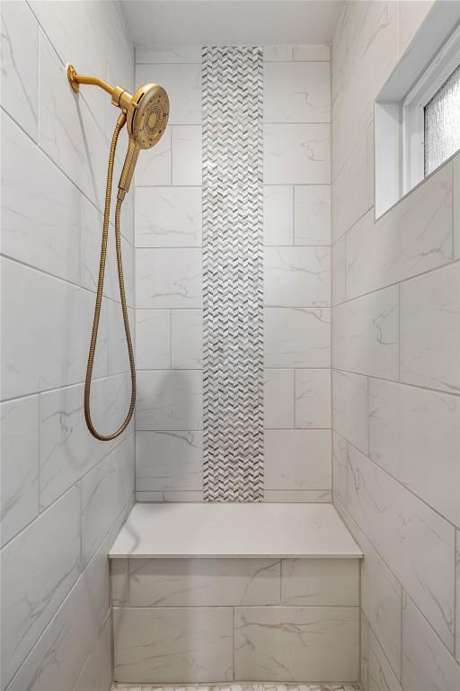 bathroom with tiled shower