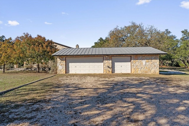 garage featuring a yard