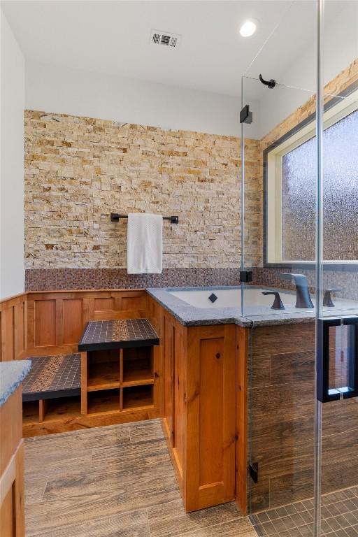 bathroom featuring a tub to relax in