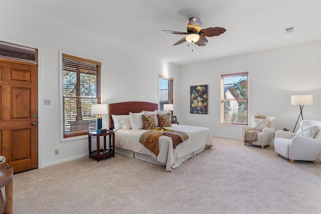 bedroom featuring ceiling fan and light colored carpet