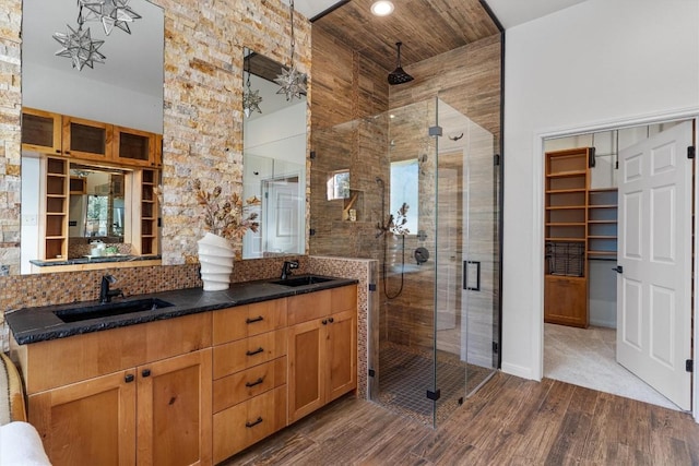 bathroom with hardwood / wood-style floors, vanity, wood ceiling, and walk in shower