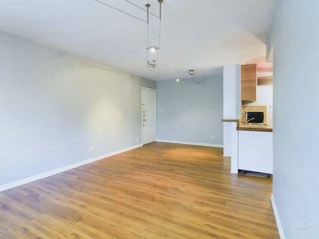 unfurnished living room featuring light wood-type flooring