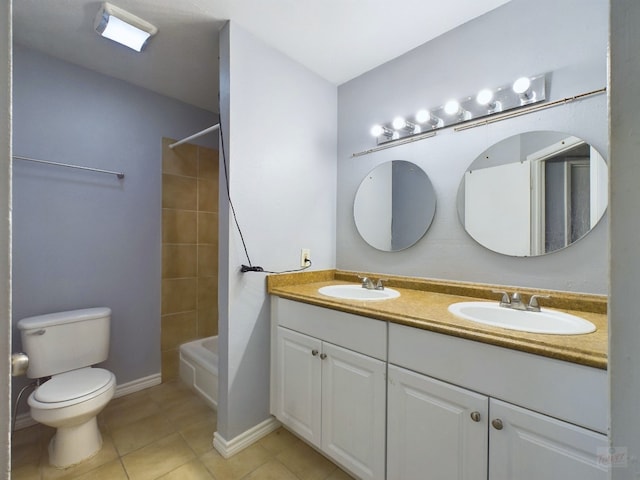 full bathroom featuring tile patterned floors, vanity, toilet, and tiled shower / bath