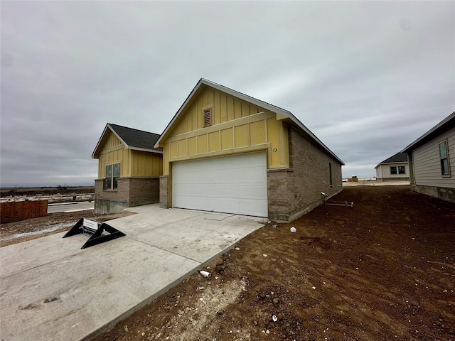 view of side of property featuring a garage