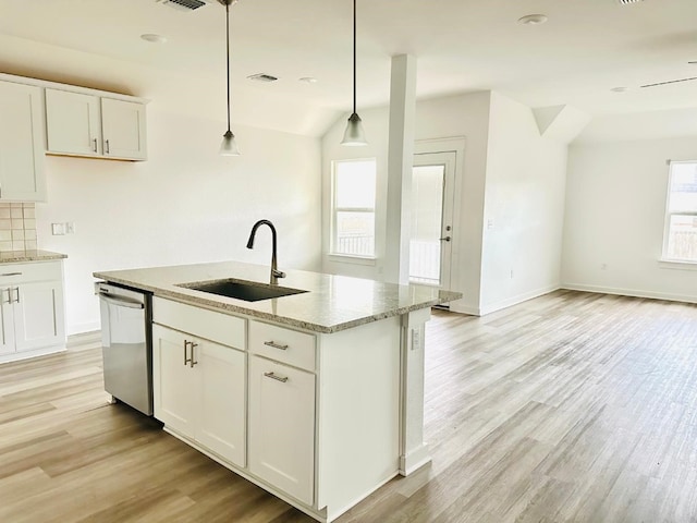 kitchen with white cabinets, dishwasher, sink, and hanging light fixtures