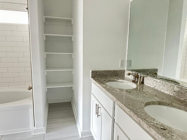 bathroom with hardwood / wood-style flooring and vanity