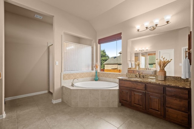 bathroom with tile patterned floors, separate shower and tub, vanity, and vaulted ceiling