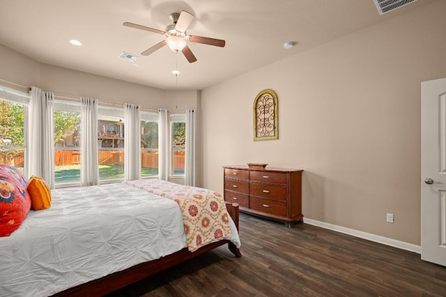 bedroom with ceiling fan and dark wood-type flooring