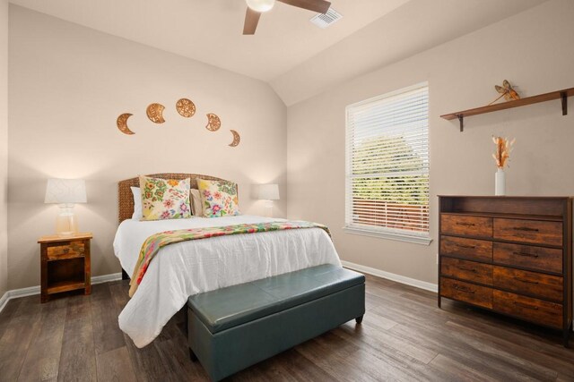 bedroom featuring ceiling fan, dark hardwood / wood-style flooring, and vaulted ceiling