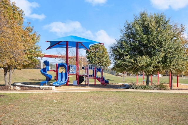 view of jungle gym with a lawn