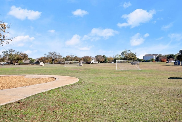 view of property's community with a yard