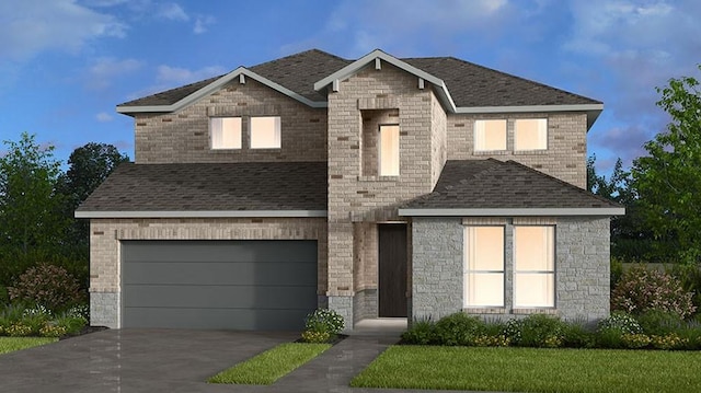 view of front of home featuring a front lawn and a garage