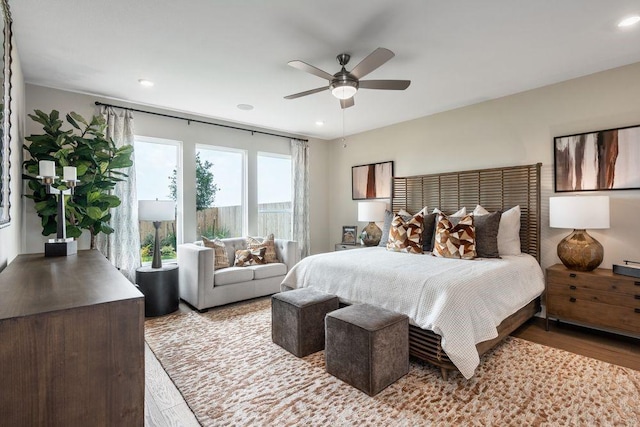 bedroom featuring light hardwood / wood-style flooring and ceiling fan