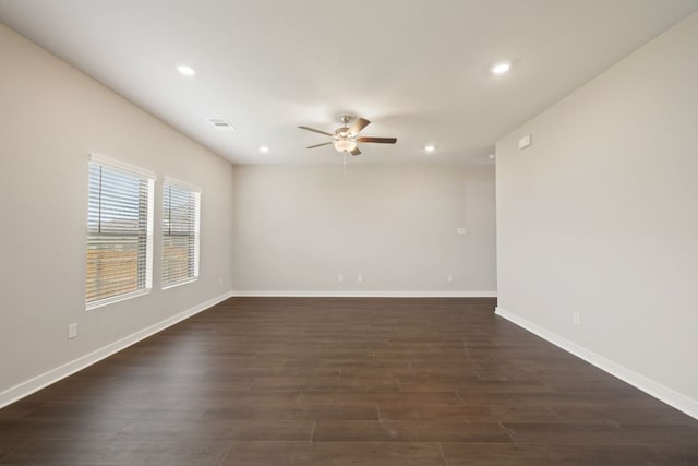 unfurnished room with a ceiling fan, dark wood-type flooring, recessed lighting, and baseboards