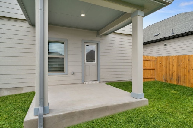 entrance to property featuring a patio