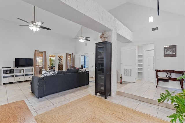 living room with high vaulted ceiling, tile patterned floors, ceiling fan, and french doors