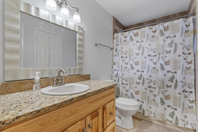 bathroom with toilet, vanity, a shower with curtain, and tile patterned flooring