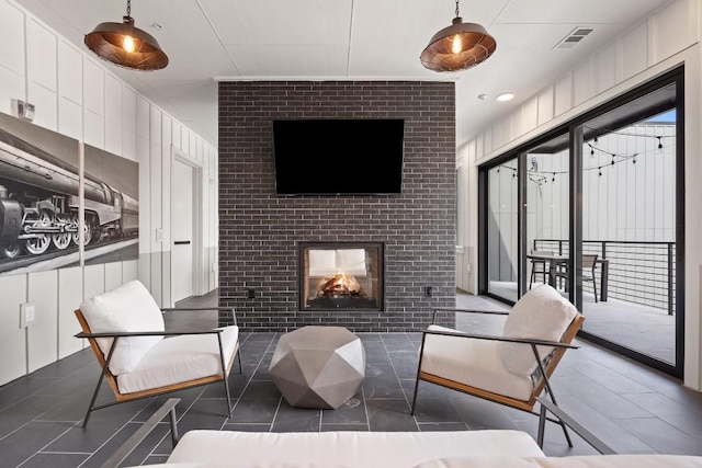 interior space with a brick fireplace