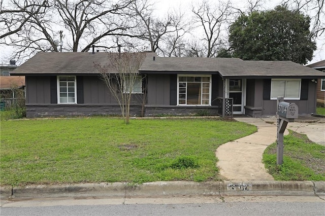 ranch-style house with a front yard