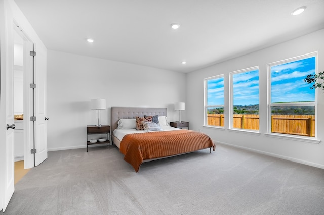 bedroom with recessed lighting, baseboards, and carpet