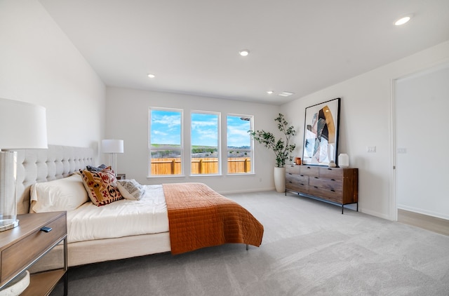 carpeted bedroom featuring recessed lighting and baseboards