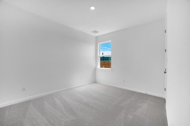 unfurnished room with recessed lighting, visible vents, baseboards, and carpet flooring