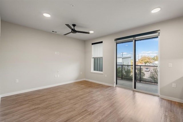 unfurnished room featuring hardwood / wood-style floors and ceiling fan