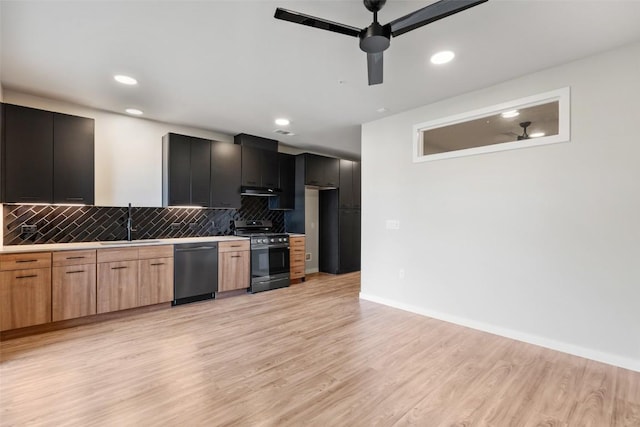 kitchen with light hardwood / wood-style floors, sink, backsplash, and appliances with stainless steel finishes