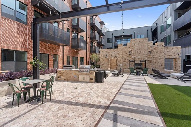 view of patio featuring area for grilling and exterior kitchen