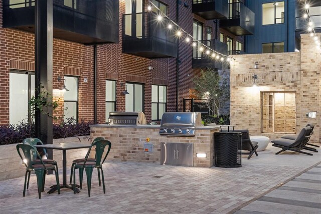 view of patio / terrace with area for grilling and a grill