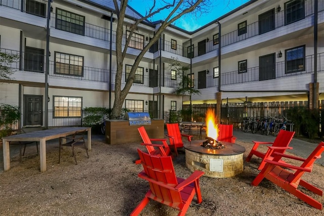 view of patio / terrace with grilling area and an outdoor fire pit