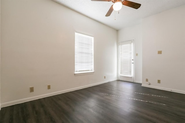 unfurnished room with a textured ceiling, ceiling fan, and dark wood-type flooring