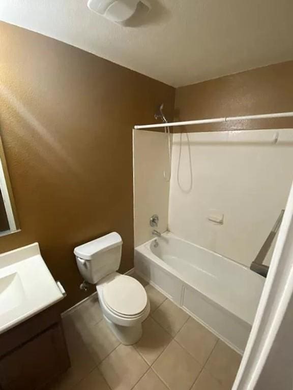 full bathroom featuring tile patterned flooring, bathtub / shower combination, vanity, and toilet