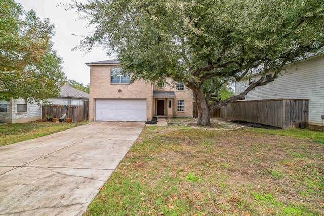 view of front of property featuring a garage and a front lawn