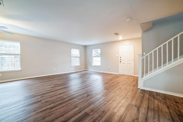 interior space with dark hardwood / wood-style floors and ceiling fan